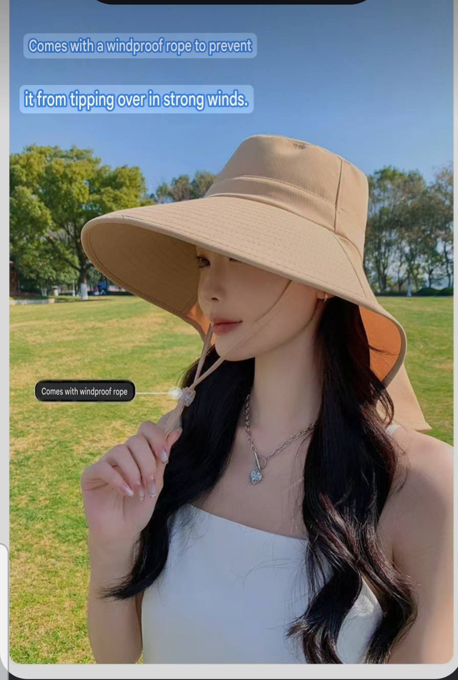 Woman wearing a beige wide brim neck-covering sun hat