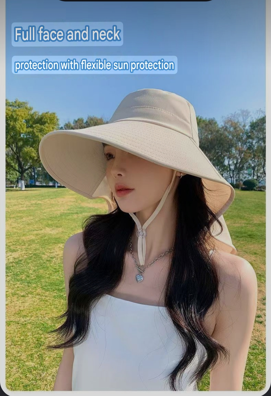 Ponytail opening on a black neck-covering sun hat